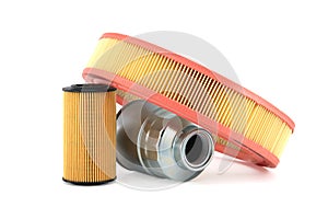 Round air filter, fuel and oil filters isolated on a white