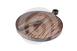 Round ash wooden cutting board on a white background