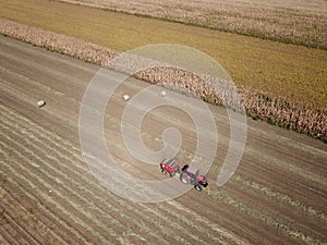 Round baler Tractor baling hay