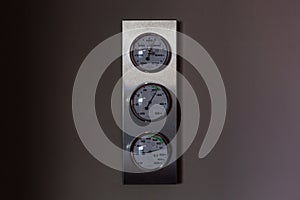 Round barometer, thermometer, hygrometer. Analog device for measuring measurement of atmospheric pressure, humidity and