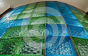 Round bathroom wall from blue and green glass tile