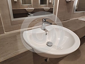 Round bathroom washing sink on marble stone surface