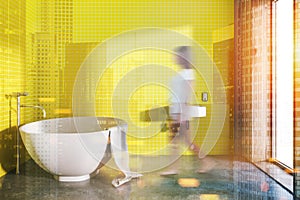 Round bathtub yellow bathroom interior toned