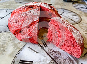 A round beet bread with cranberries