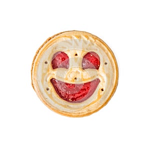 Round biscuit smiling face on the white background, humorous sweet food