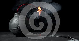 Round black bomb with lit fuse burning, sparking, and smoking. Bomb about to detonate symbolizing destruction, threats, or