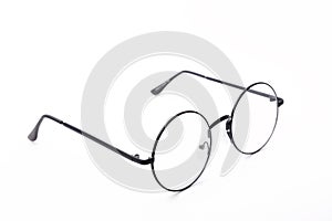 Round black-rimmed glasses are located frontally on a white background.