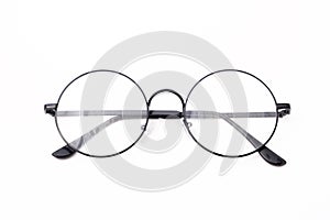 Round black-rimmed glasses are located frontally on a white background. Isolated. photo