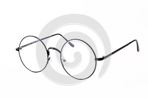 Round black-rimmed glasses are view from above. Isolated on a light background. photo