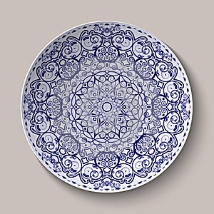 Round blue floral ornament Chinese style painting on porcelain. Pattern shown on the ceramic platter.