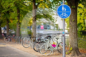 A round blue road sign. The path is permitted for pedestrians and cyclists.