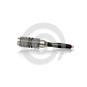 Round brush for styling hair with reflection. Isolated on a white background. Hairdressing tools