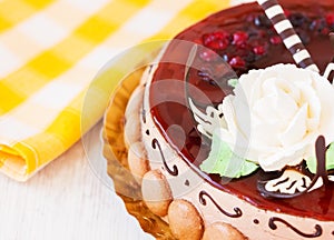 Round cake with cherry and biscuits