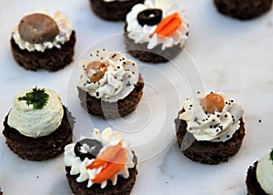 Round canapes with a variety of cream cheese fillings