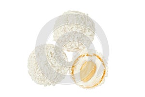 round candy raffaello with coconut flakes and nut isolated on white background. Top view. Flat lay. photo