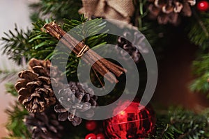 Round Christmas wreath with red baubles and berries