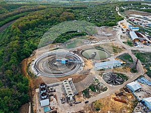 Round clarifiers at wastewater treatment plant, aerial view from drone