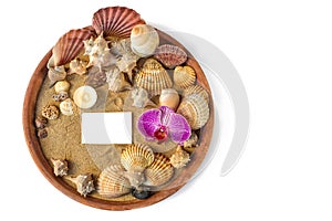 Round summer beach spa vacation still life composition flat lay sand, shells, candle, corals, stone, orchid, clean business card