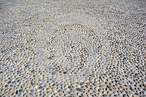 Round cobblestone pebble in concrete, street pavement