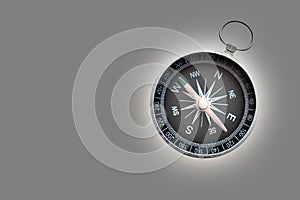 Round compass on gray background as symbol of tourism with compass, travel with compass and outdoor activities with compa photo