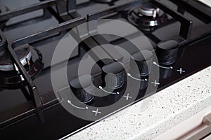 Knobs control gas stove close-up