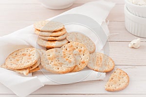 Round crackers on white linen napkin