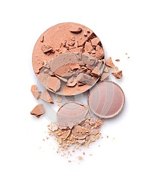 Round crashed beige face powder and nude color eyeshadow for makeup as sample of cosmetics product
