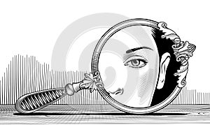 Round decorative retro mirror on a wooden table with reflection of a woman\'s face