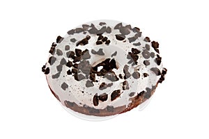 Round donut with chocolate crumbs and white icing isolated on a white background. The concept of junk food