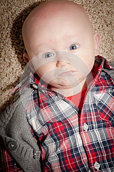 Round Face Baby Boy With Big Blue Eyes