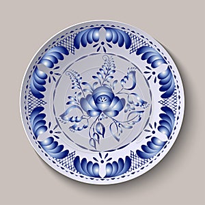 Round floral ornament Gzhel style. Pattern shown on the ceramic plate. photo