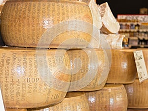 Round forms of Parmigiano Reggiano Italian cheese for sale