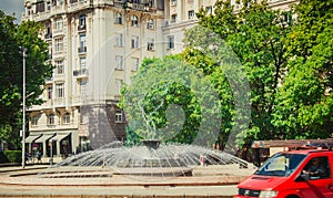 Round fountain in the center of Sofia in sunny day photo