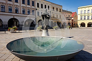 Round fountain with Socha svateho Mikulase statue at Masarykovo namesti town square in Novy Jicin