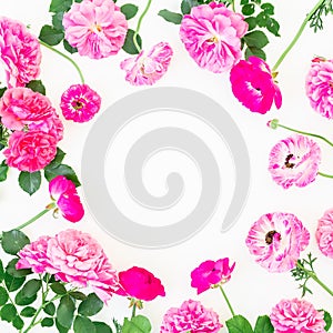 Round frame of beautiful ranunculus flowers, roses and leaves on white background. Flat lay, top view. Floral lifestyle compositio
