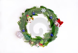 Round frame made of pine branches decorated with Christmas toys isolated on white background. Christmas or New Year concept