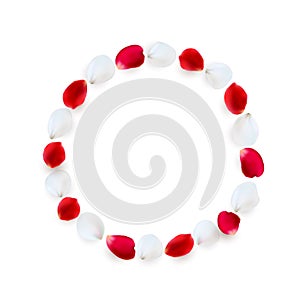 Round frame made of rose petals. White and red petals arranged in a circle.