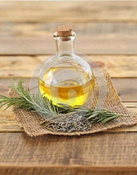 Round Glass Bottle of Oil with Herbs