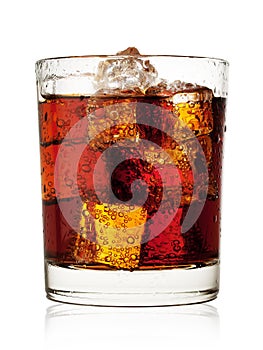 Round glass of cola with ice