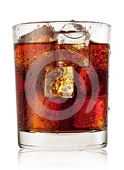 Round glass of cola with ice