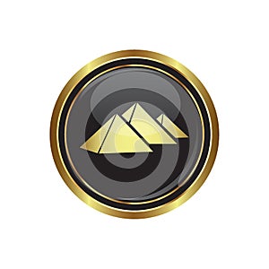 Round golden button with pyramids icon photo