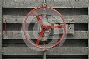 Round handle of the lock of hermetic door of old bomb shelter