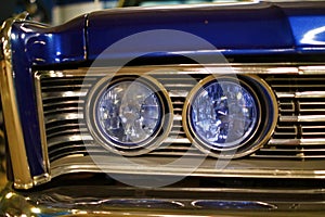 Round headlights of an old vintage car