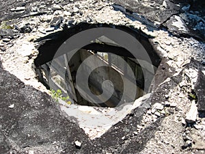 round hole in roof of the old building. Abandoned industrial bui