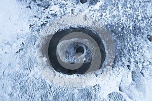 Round hole. winter season, ice hole for fishing