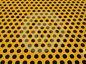 Round holes in yellow perforated metal plate