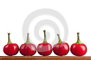 Round hot chilly peppers on a table