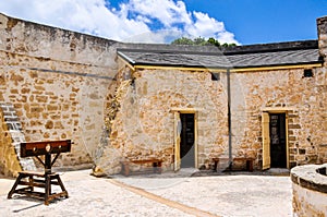 The Round House: Colonial Limestone and Stocks