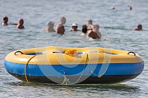 Round inflatable mattress on the water without people