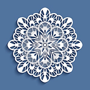 Round lace doily, cutout paper pattern photo